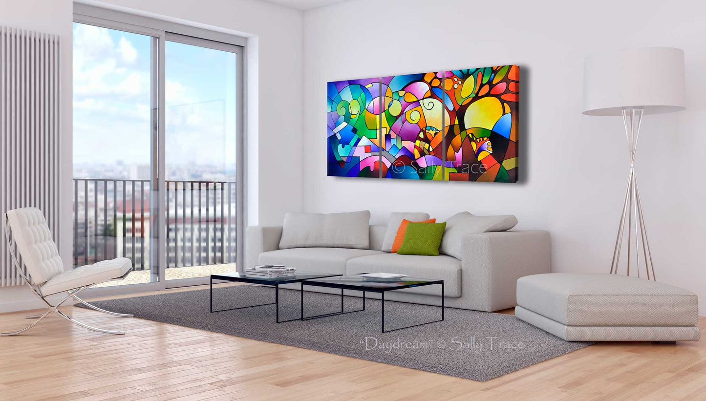 Canvas giclee print of Sally Trace painting "Daydream" extra large wall art, Colorful abstract geometric landscape canvas prints for sale, three giclee prints on canvas made from my beautiful original acrylic triptych acrylic on canvas painting "Daydream", oversized geometric canvas painting prints wall art, geometric shapes, expressionism with geometric trees, mountains, sky, blue yellow paintings., room view